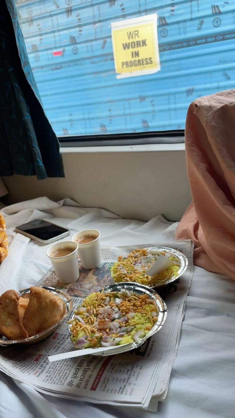 Poha, samosas and chai on a berth